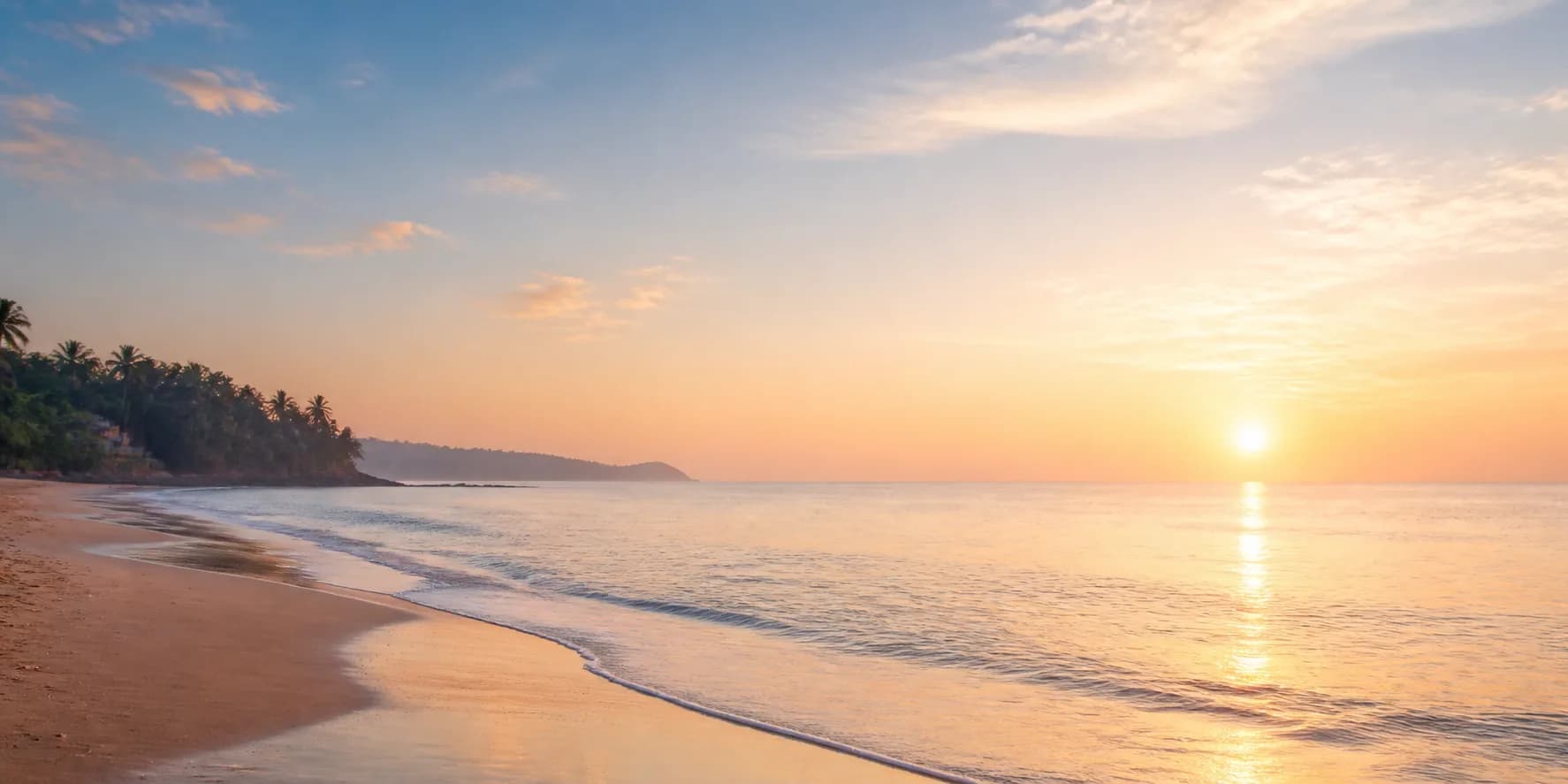 A clean Goa beach and coastline at sunrise
